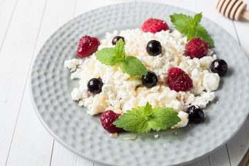 Russian cottage cheese with berries, honey mint, selective focus, healthy Breakfast