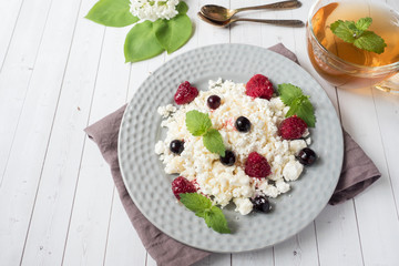 Russian cottage cheese with berries, honey mint, selective focus, healthy Breakfast