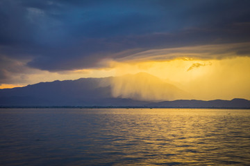 Obraz premium Sunset storm raining cloud