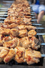 The meat is fried on sticks on charcoal
