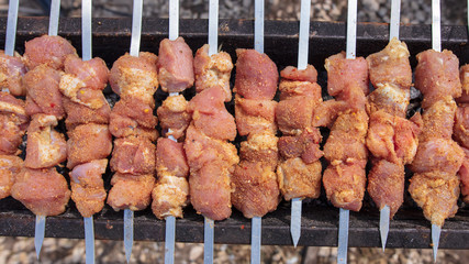The meat is fried on sticks on charcoal