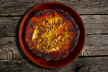 oven roasted pumpkin cul half on a wood