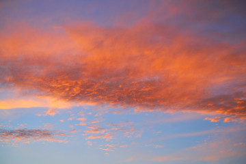 Fototapeta na wymiar Sunset sky with orange clouds and blue