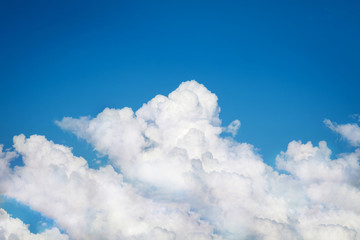 Naklejka na ściany i meble white cumulus clouds on blue sky background