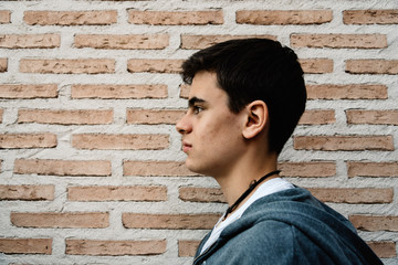 Side head shot of young adult man