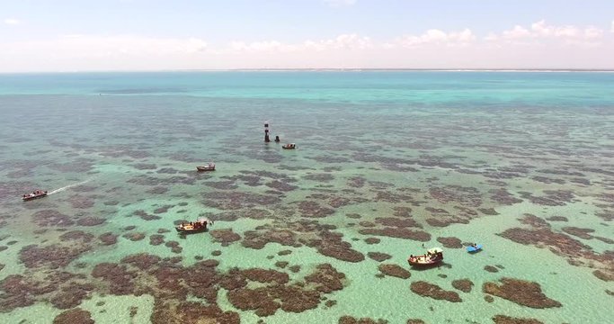 Aerial view of boats in turquoise sea of Rio do Fogo, Brazil.