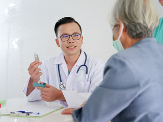 Elderly woman in hospital with doctor.