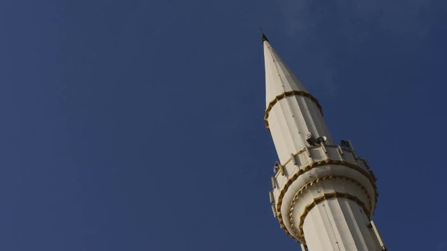 Mosque minaret with time lapse clouds