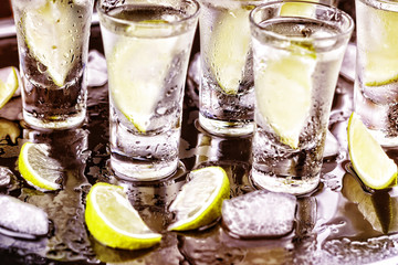 alcohol, cocktail. vodka, gin, tequila with lime. party