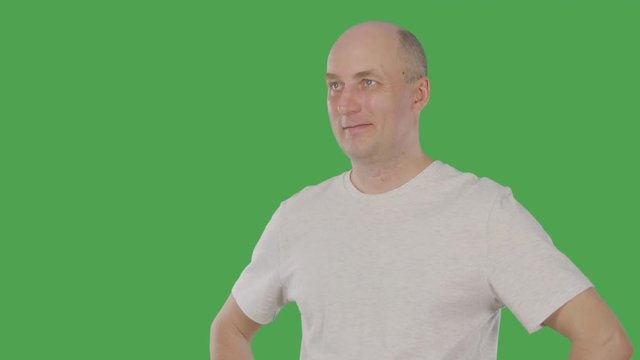 Adult Man Nodding Head And Listening Interlocutor Isolated On Green Background. Alpha Channel, Keyed Green Screen