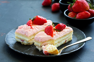 strawberry cake. dark background.