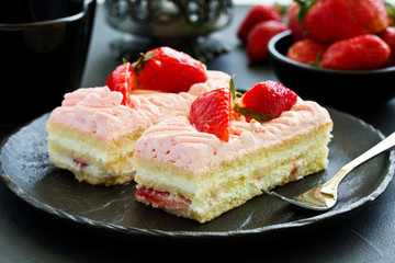 strawberry cake. dark background.