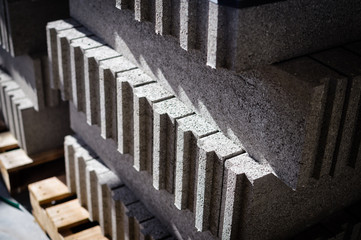 Motion blur image of cement building blocks trade stacked piled in warehouse development...