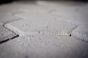 Motion blur image of cement building blocks trade stacked piled in warehouse development background. Closeup on fabric plant manufacture stockpile, grey textured abstract surface
