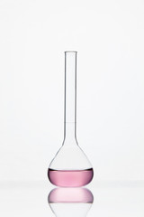 Laboratory Glassware. Glass With Pink Liquid On White Background