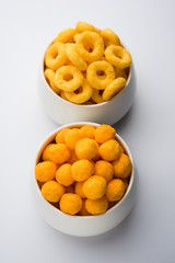 Kaju Katli is a Diamond shape Indian sweet made using cashew sugar and mava, served in a plate or bowl over moody background. selective focus