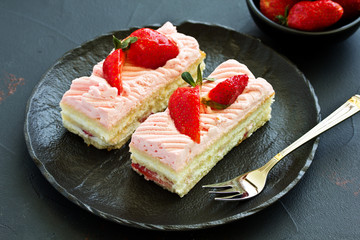 strawberry cake. dark background.