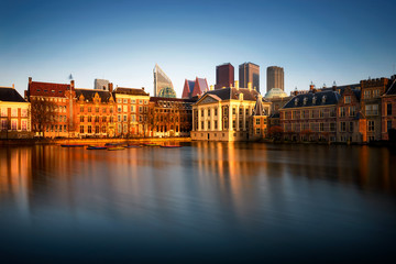 Skyline of The Hague with the modern office buildings. Reflection of Hofvijver lake in Den Haag, Netherlands.