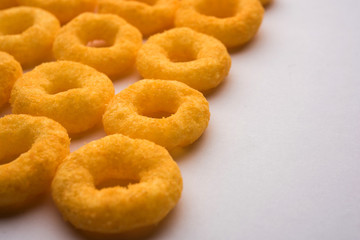 Kaju Katli is a Diamond shape Indian sweet made using cashew sugar and mava, served in a plate or bowl over moody background. selective focus