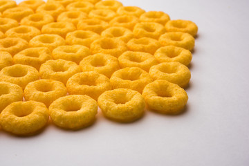 Kaju Katli is a Diamond shape Indian sweet made using cashew sugar and mava, served in a plate or bowl over moody background. selective focus