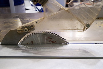 The image of the sawing machine. A circular saw.