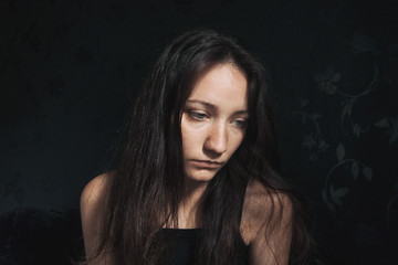 Fototapeta premium sad girl looking down