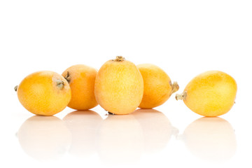 Fresh orange Japanese loquats group isolated on white background.