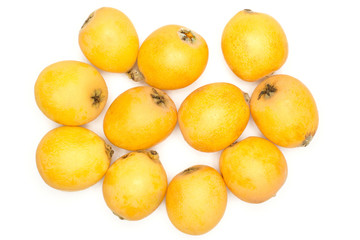 Fresh orange Japanese loquats top view isolated on white background.