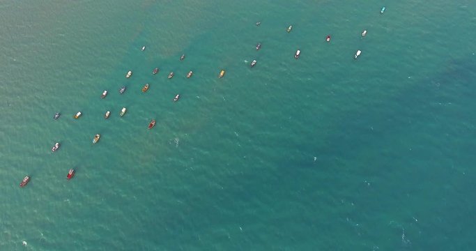 Aerial view of traditional fishing boat moored in the turquoise sea of Rio do Fogo, Brazil.