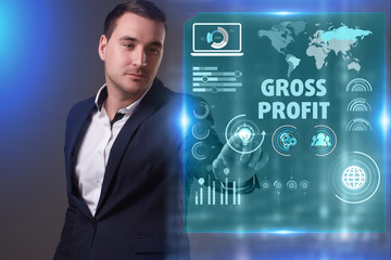Business, Technology, Internet and network concept. Young businessman working on a virtual screen of the future and sees the inscription: Gross profit