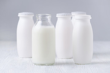 bottles of drink yogurt, glass and plastic