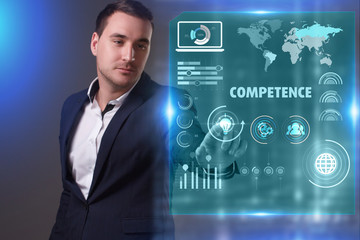 Business, Technology, Internet and network concept. Young businessman working on a virtual screen of the future and sees the inscription: Competence