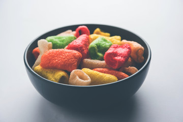Delicious spicy chicken biryani in bowl over moody background, it’s a popular Indian and Pakistani food.