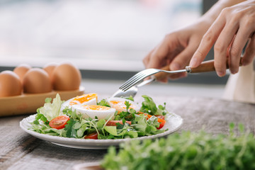 Lambs lettuce salad, hard-boiled eggs, tomatoes and honey mustard dressing
