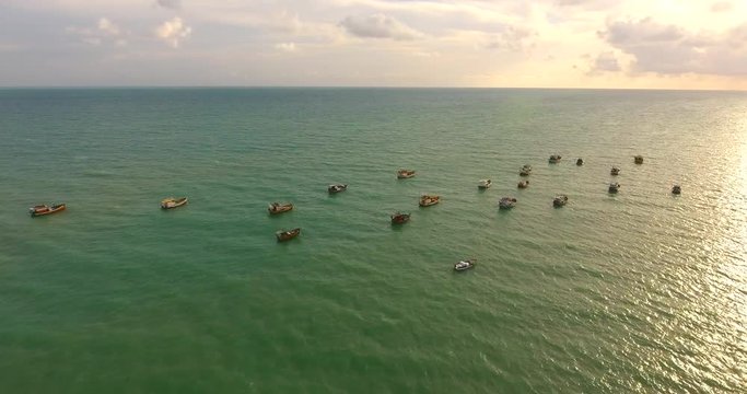Aerial view of traditional fishing boat moored in the turquoise sea of Rio do Fogo, Brazil.