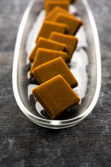 Alphonso Mango Burfi or Hapus Amba Vadi served in a plate, selective focus