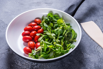 Fresh vegetables in white ceramic pan
