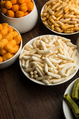 Kaju Katli is a Diamond shape Indian sweet made using cashew sugar and mava, served in a plate or bowl over moody background. selective focus