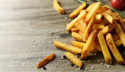 French fries chips meal with on wood background. Unhealthy weight loss diet 