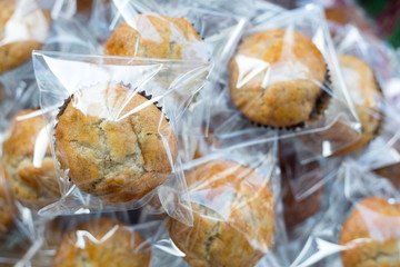 Banana cupcake in plastic wrap packaging.
