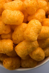 Kaju Katli is a Diamond shape Indian sweet made using cashew sugar and mava, served in a plate or bowl over moody background. selective focus