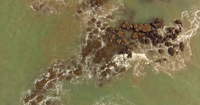 Aerial view of rocky sea in Cajueiro, Brazil.