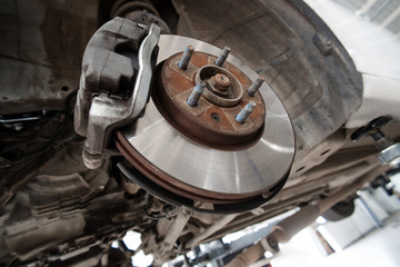 Disc brakes. assembly on a modern automobile - Brake work in progress.