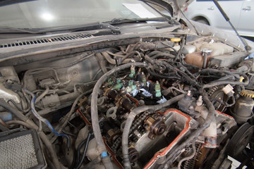 Engine valve car maintenance.The cylinder block of the four-cylinder engine. Disassembled motor vehicle for repair.