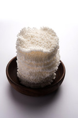 Basundi Or Rabri is an Indian sweet popular in Gujarat and Maharashtra. It is a sweetened condensed milk. Garnished with Dry fruits and Saffron. Served in a bowl over moody background. Selective focus