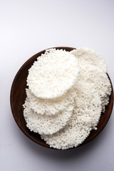 Indian Aloo Mutter curry - Potato and Peas immersed in an Onion Tomato Gravy and garnished with coriander leaves. Served in a Karahi/kadhai or pan or bowl. selective focus