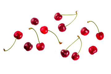 Obraz na płótnie Canvas Ripe raw organic cherry, isolated on white background, simple pattern