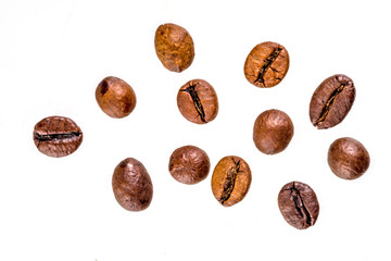 Golden roasted coffee beans isolated on white background