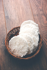 Indian food - Aloo curry masala. Potato cooked with spices and herbs in a tomato curry. served in a bowl over moody background. selective focus