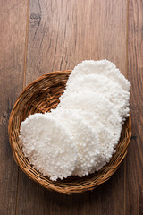 Basundi Or Rabri is an Indian sweet popular in Gujarat and Maharashtra. It is a sweetened condensed milk. Garnished with Dry fruits and Saffron. Served in a bowl over moody background. Selective focus